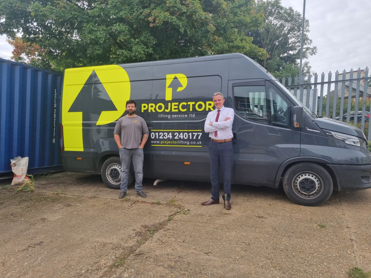 Peter Jones of DragTech with Adam Rogers of Projector Lifting Service Ltd beside their liveried van